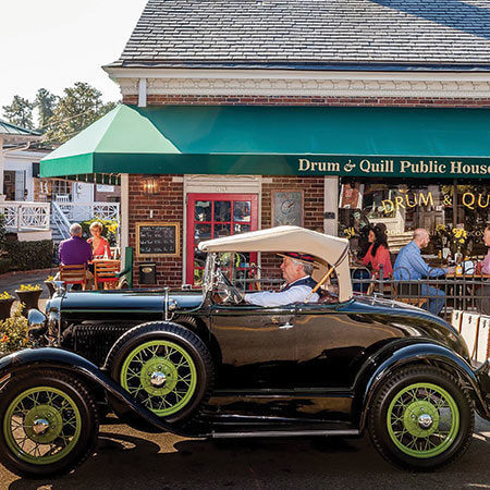 Antique car in front of The Drum & Quill in Pinehurst