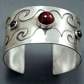 JLK cuff with deep red stone.