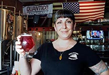 Railhouse Brewery's Nicole Meyer with a glass of Madame Cerise, a cherry pastry sour limited release. 