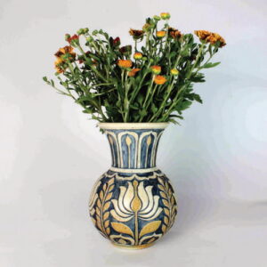 Pottery jug with flowers inside