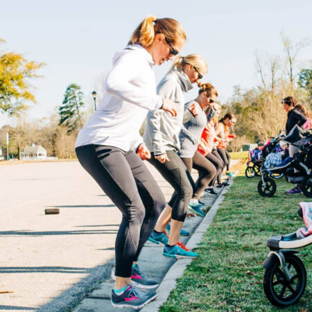 Mothers exercising with children in strollers